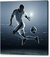 Soccer Player Kicking Ball In Stadium Canvas Print