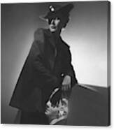 A Model Wearing A Wool Jacket And Hat Canvas Print