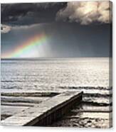 A Rainbow Shining In The Storm Clouds Canvas Print