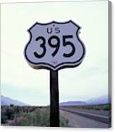 A Road Sign On A Desert Highway Canvas Print