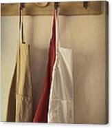 Aprons Hanging On Hooks With Vintage Feel Canvas Print