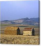 Bales Of Straw Stacked In The Shape Of A House Next To A Little Stone House. Limagne. Auvergne. Fran Canvas Print