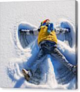 Boy Making A Snow Angel Canvas Print