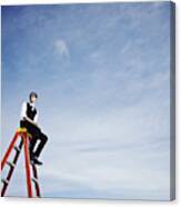 Businessman Sitting On Top Of Ladder Looking Out Canvas Print