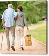 Caregiver – Woman Helping Senior Man With Shopping Canvas Print