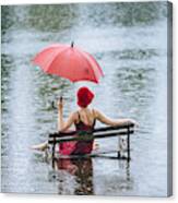 Caucasian Woman Sitting On Bench In Flood Canvas Print