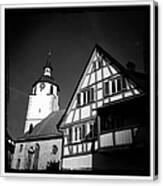 Church And Half-timbered House In Lovely Old Town Canvas Print