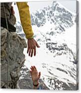 Climber Offers Teammate A Helping Hand Canvas Print