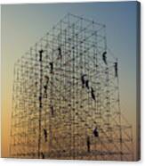 Construction Workers On Scaffold At Sunset Canvas Print