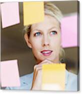 Contemplative Business Woman With Sticky Notes On Glass Window Canvas Print