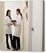 Doctors Talking In Hallway Canvas Print