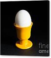 Egg In Cup At Black Background Canvas Print