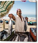 Fisherman Selling His Fish At Market On Canvas Print