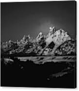 Full Moon Sets In The Teton Mountain Range Canvas Print