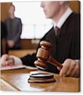 Judge Holding Gavel In Courtroom Canvas Print