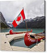 Lake Louise Canoes And Flag Canvas Print
