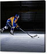 Male Ice Hockey Player Skating With Canvas Print