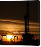 Oil Rig And Two Pumpjacks In The Sunset Canvas Print
