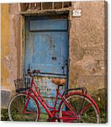 Old Red Bicycle Leaning Against A Canvas Print