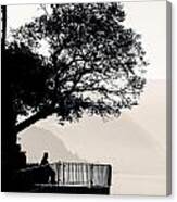 One Old Man Sitting In Shade Of Tree Overlooking Lake Como Canvas Print