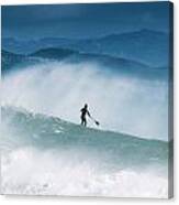 Paddleboarding In The Waves Along The Canvas Print