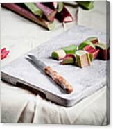 Pieces Of Rhubarb And Knife On Chopping Canvas Print
