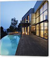 Pool Outside Modern House At Twilight Canvas Print