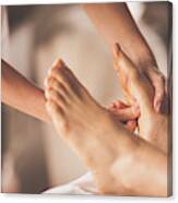 Reflexologist Applying Pressure To Foot With Thumbs Canvas Print