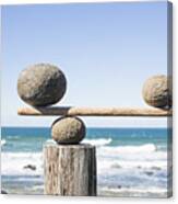 Rocks Balancing As Scale On Wooden Plank Canvas Print