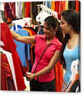 Salesgirl Showing Dress To Woman In Supermarket Canvas Print
