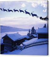 Santa Clause With Reindeer Flying Above A Farm Canvas Print
