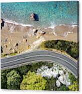 Seaside road approaching a beach, seen from above Canvas Print