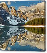 Snow Clings To Shoreline Of Mountain Canvas Print