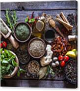 Spices And Herbs On Rustic Wood Kitchen Table Canvas Print