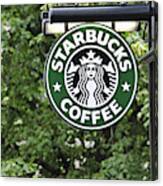 Starbucks Coffee Sign Hanging Outside A Shop Canvas Print