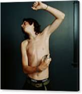 Teenage Boy (14-16) Spraying Underarm With Deodorant Canvas Print