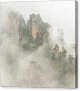 The Foggy Peaks Canvas Print