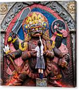 A Nepali School Girl Offers A Butter Lamp To The Fearsome Kala Bhairava Canvas Print
