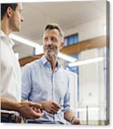 Two Businessmen Discussing In Factory Canvas Print