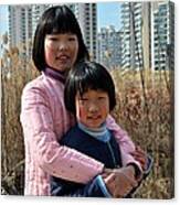 Two Chinese Teen Sisters Hug  And Embrace Shanghai China Canvas Print