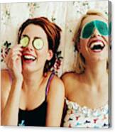 Two Female Teenagers Lying In Bed Wearing Eye Masks Canvas Print