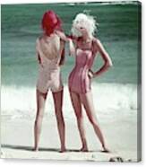 Two Models Standing On A Beach Canvas Print