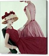 Two Models Wearing Red Dresses Canvas Print