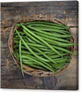 Wickerbasket Of Green Beans On Dark Wood Canvas Print