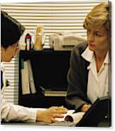 Woman Doctor In Her Office Consulting With Patient Canvas Print