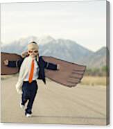 Young Boy Businessman Dressed In Suit With Cardboard Wings Canvas Print