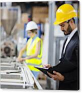Young Quality Inspector Checking Production Line Canvas Print