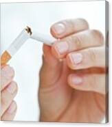 Young Woman Breaking Cigarette In Half Canvas Print