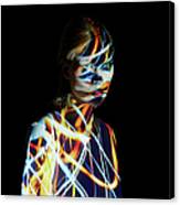 Young Woman Covered In Colorful Lights Canvas Print