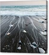 Pebbles In The Beach And Flowing Sea Water Canvas Print